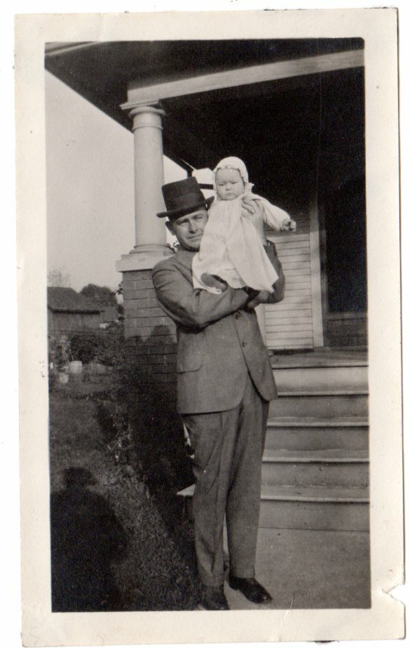 vintage 1900/10s snapshot photo man in top hat scared holding baby on shoulder vintage 1900/10s snapshot photo man in top hat scared holding baby on shoulder