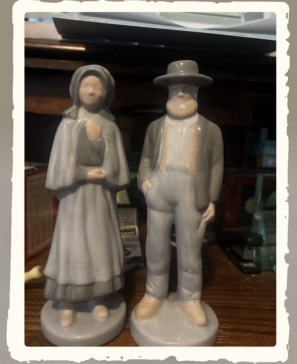 Pair of vintage porcelain figurines depicting a Amish Man And Women