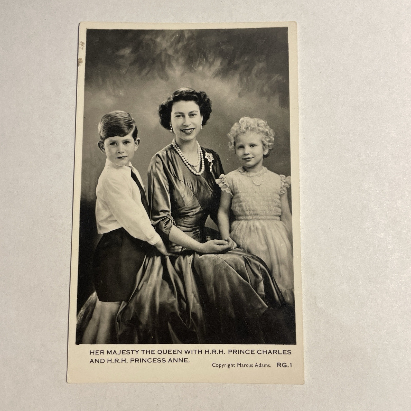 Her Majesty the Queen with H. R. H. Prince Charles and H. R. H. Princess Anne