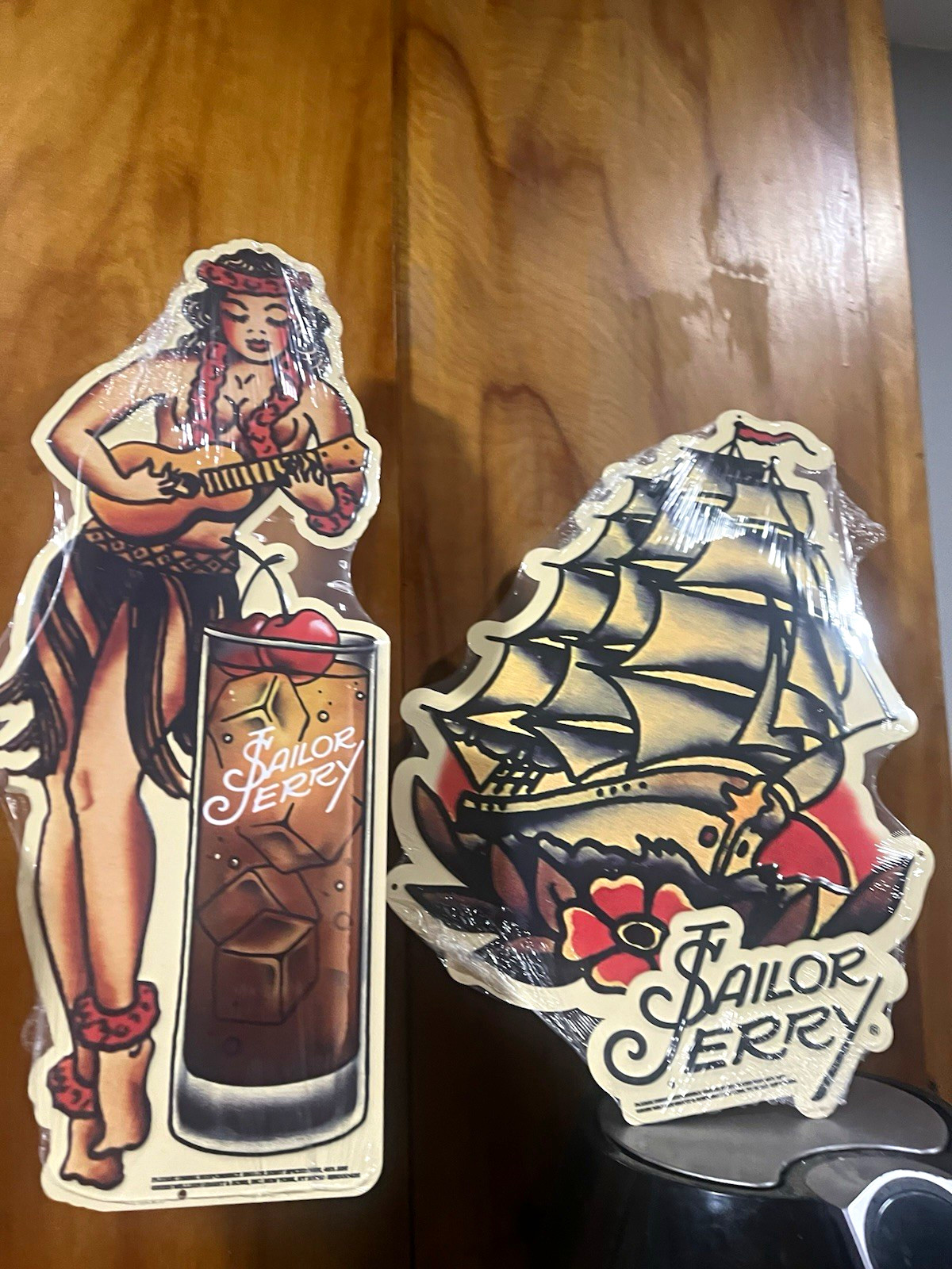 New Set (2) Sailor Jerry Hula Girl and Boat Tin signs Wrapped on Plastic New Set (2) Sailor Jerry Hula Girl and Boat Tin signs Wrapped on Plastic