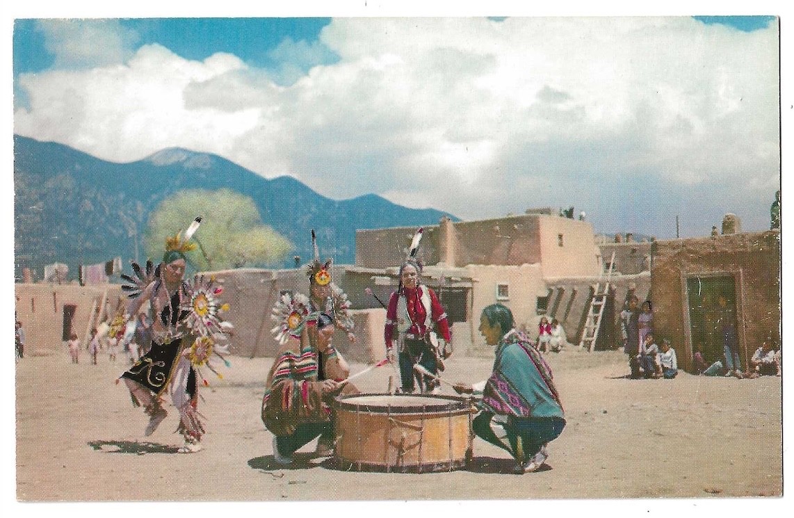 Taos Pueblo New Mexico c1950\'s Native American Dancers, drum, adobe buildings