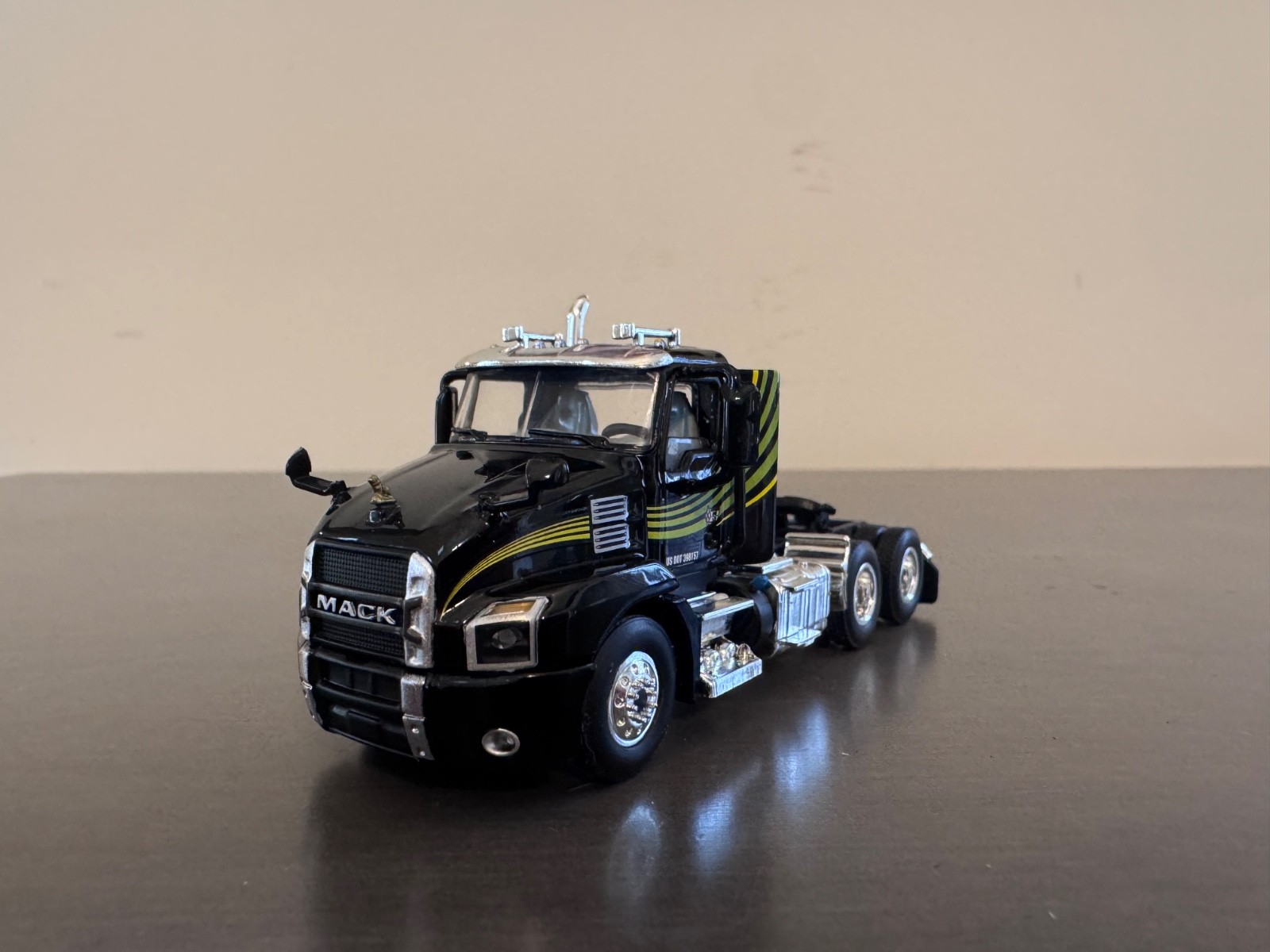 1/64 DCP/First Gear Mack Anthem Day Cab- Black w/Green Stripes