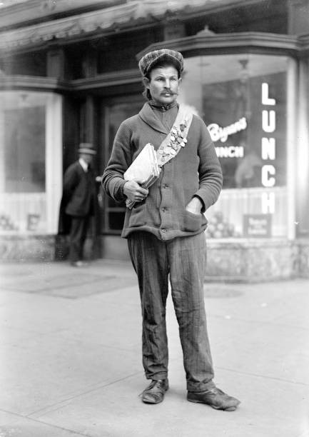 Early 1900s man American city holding books or papers wearing a me- Old Photo