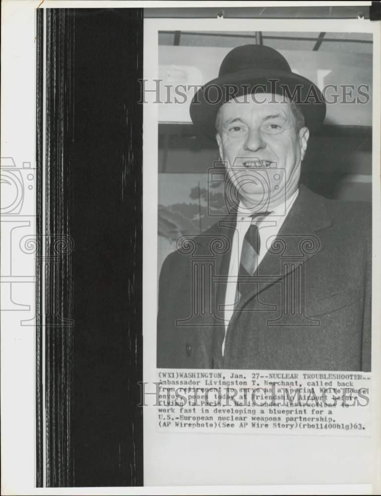 1963 Press Photo Ambassador Livingston Merchant poses at Friendship Airport