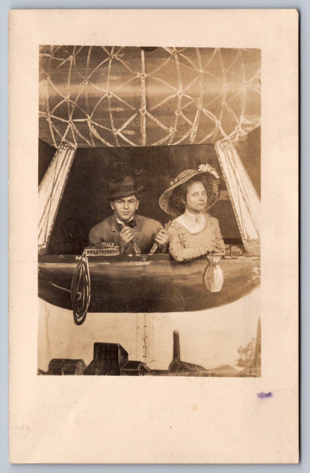 c1915 RPPC COUPLE IN AIRSHIP STUDIO FANTASY POSE/DIRIGIBLE