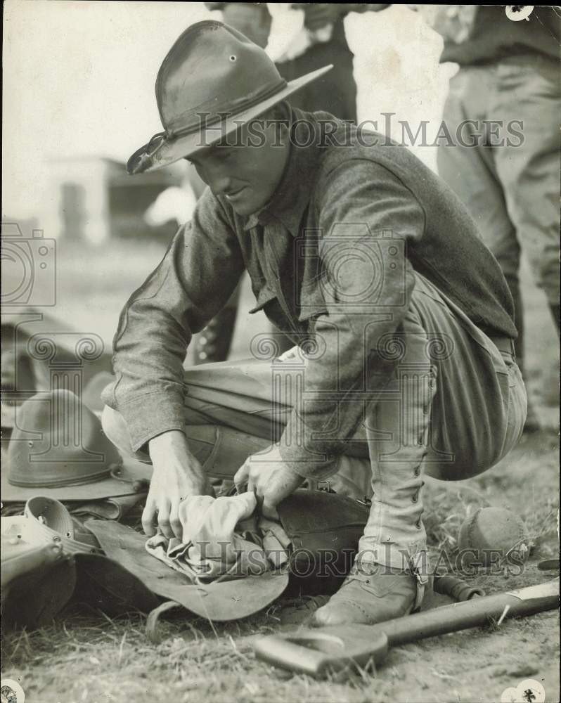 1917 Press Photo Soldier breaking camp and filling his pack in World War I 1917 Press Photo Soldier breaking camp and filling his pack in World War I
