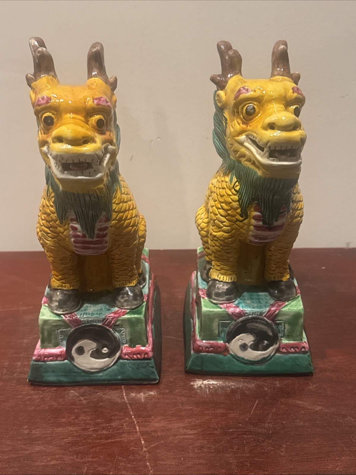 PAIR OF YELLOW AND GREEN GLAZED FU DOGS ( LIONS ) PAIR OF YELLOW AND GREEN GLAZED FU DOGS ( LIONS )