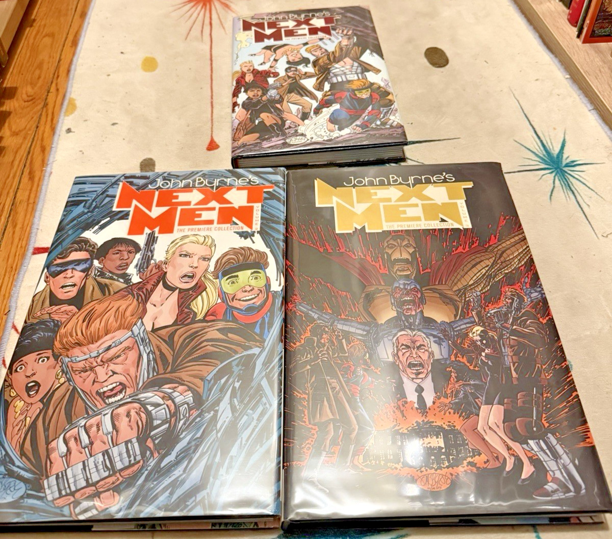 NEXT MEN: PREMIERE EDITIONS/VOLUMES 1-3/John Byrne/IDW/Hardcover/Excellent/First NEXT MEN: PREMIERE EDITIONS/VOLUMES 1-3/John Byrne/IDW/Hardcover/Excellent/First