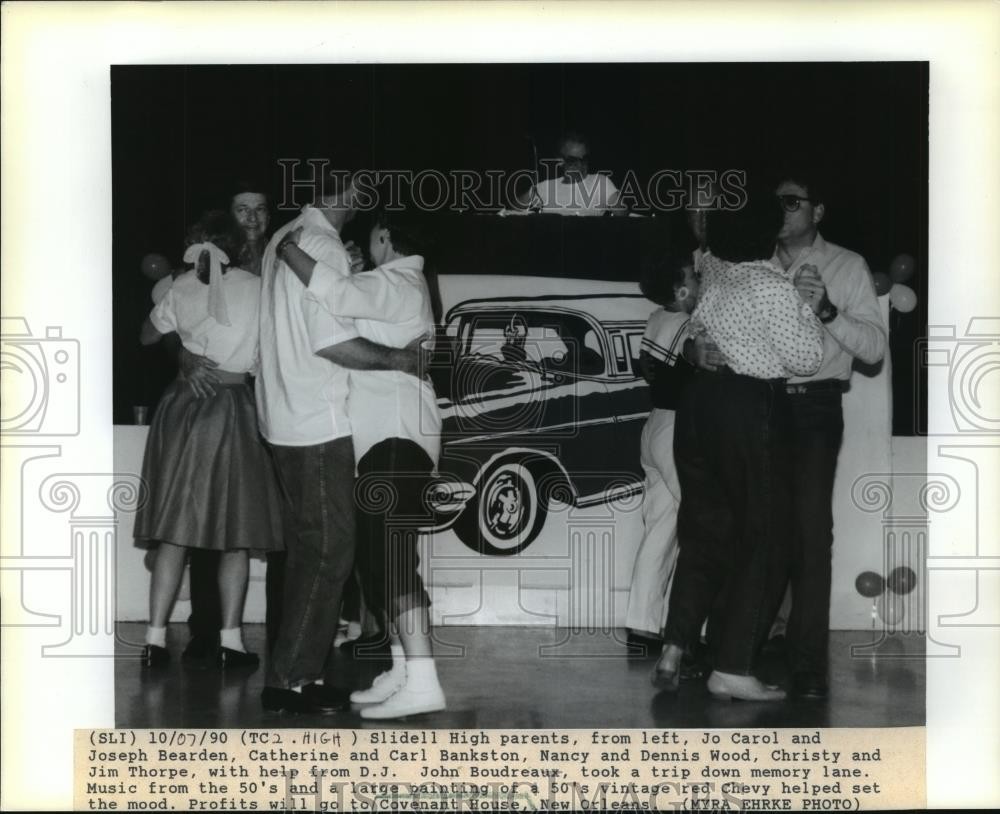 1990 Press Photo Slidell High parents go down memory lane, 50's music & red Chev