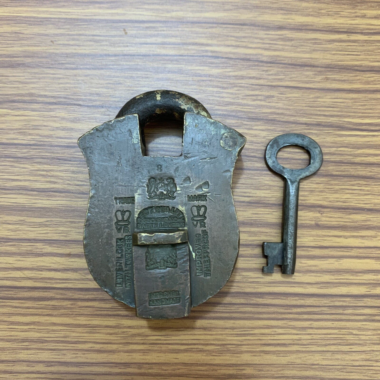 AN OLD OR ANTIQUE BRASS PADLOCK OR LOCK WITH KEY
