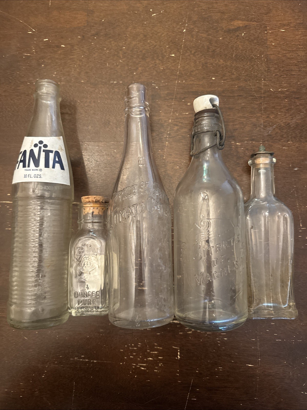 Lot of 5 Early Mid 1900’s glass bottles, honey, magnesia, fanta, tomato catsup Lot of 5 Early Mid 1900’s glass bottles, honey, magnesia, fanta, tomato catsup