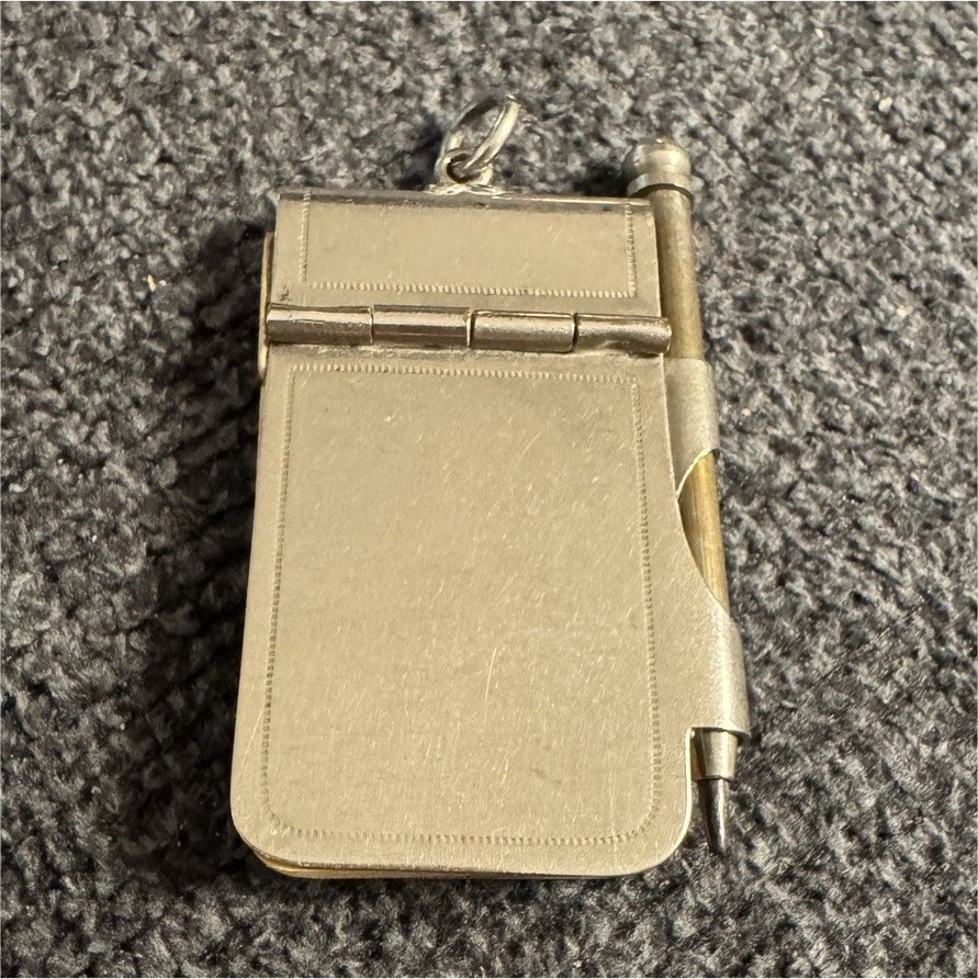 This is an antique aide-mémoire, a miniature notepad and pencil set This is an antique aide-mémoire, a miniature notepad and pencil set