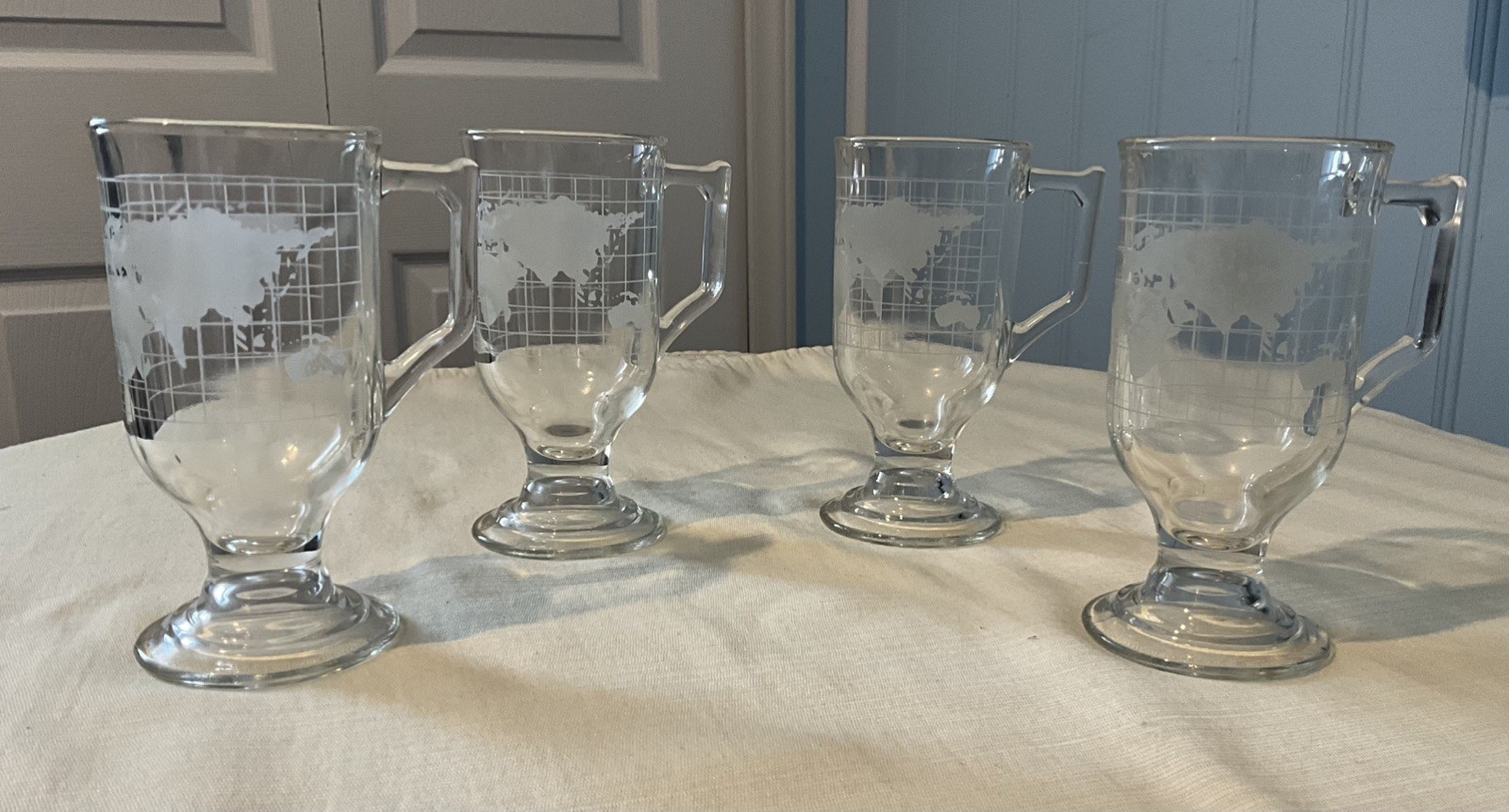 Set of 4 VTG Nestle Nescafé “Around The World” Globe Footed Etched Glass Mugs Set of 4 VTG Nestle Nescafé “Around The World” Globe Footed Etched Glass Mugs