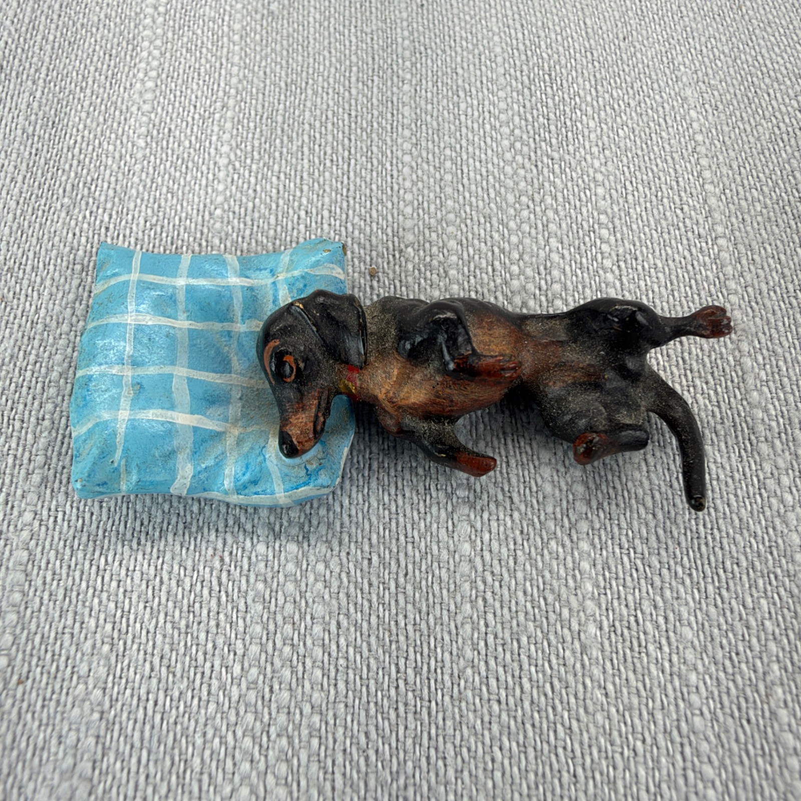 Vintage Dachshund Miniature Figurine Sleeping on Blue Pillow Metal Black Brown