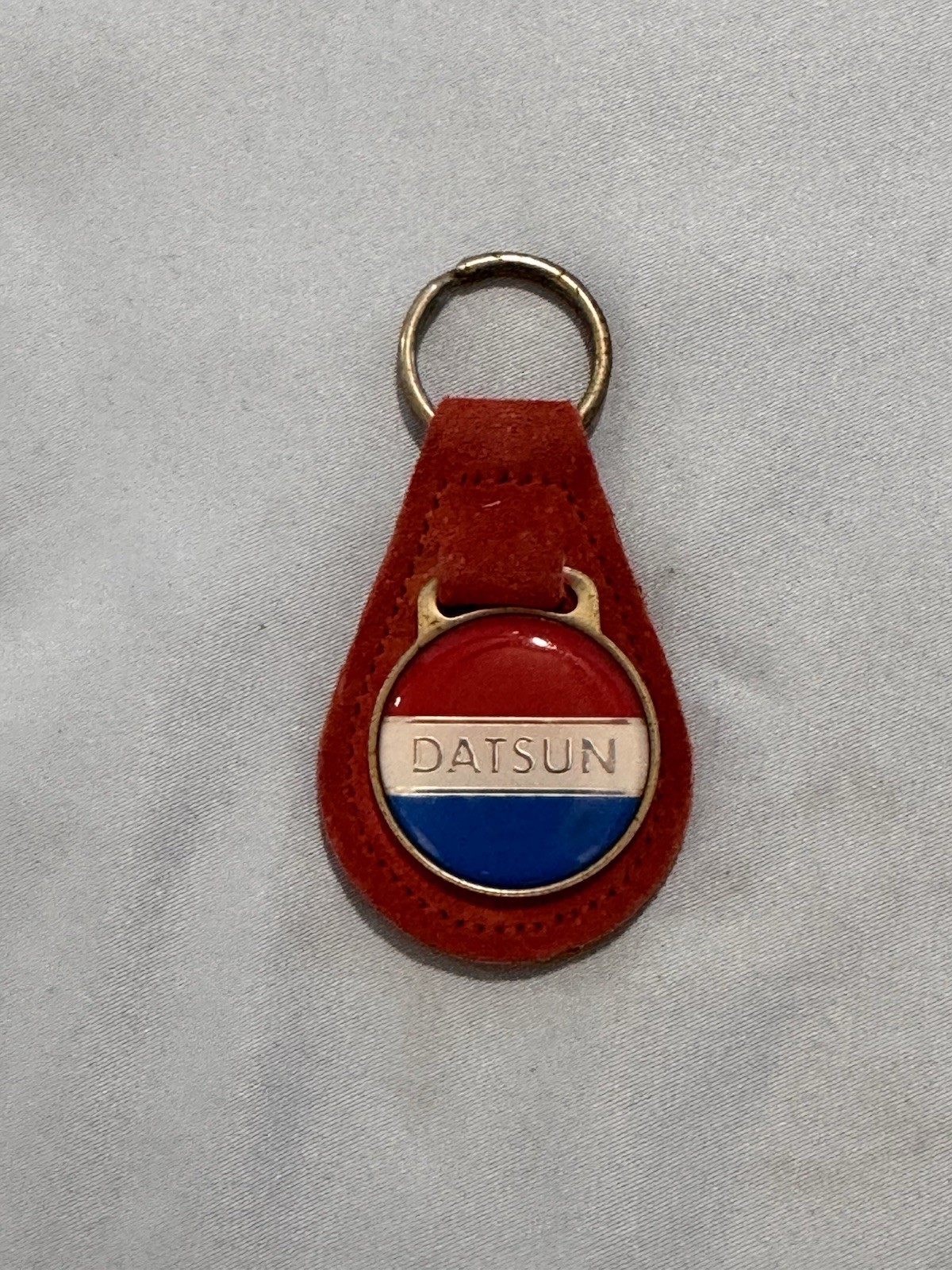 Vintage 1970’s Datson Keychain On Leather, Used In Good Condition