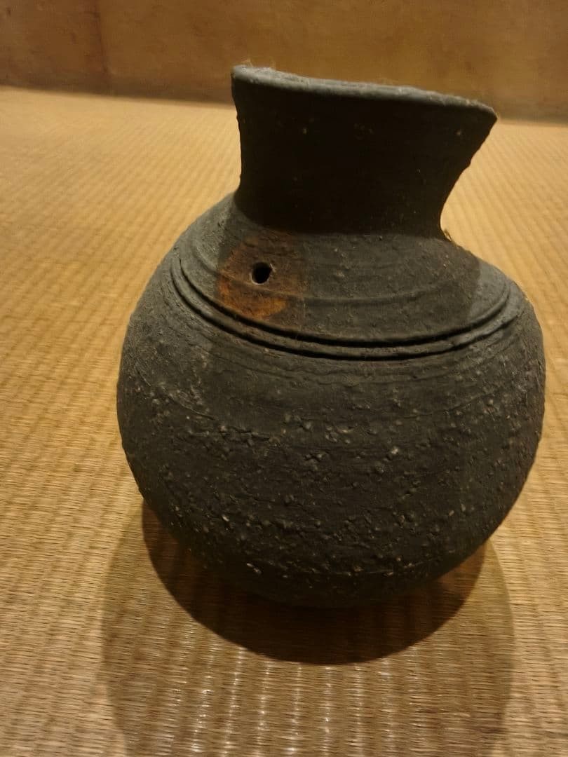 Old pottery vase black glaze ceramic distorted shape art collection
