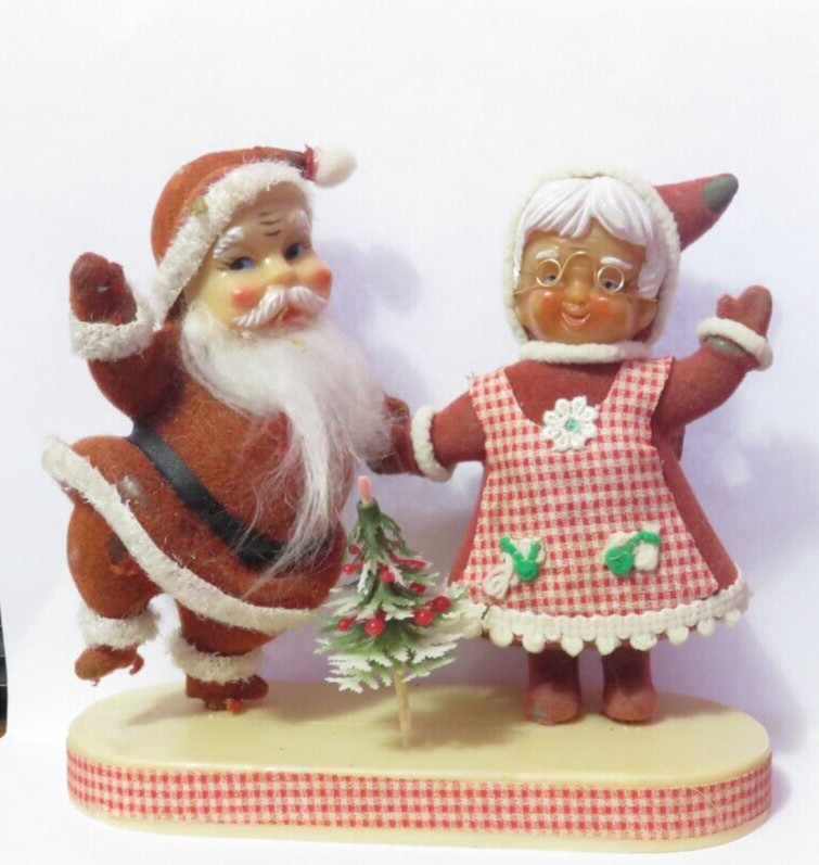 VINTAGE FELT AND PLASTIC SANTA AND MRS CLAUSE ON STAND FADED AND WORN VINTAGE FELT AND PLASTIC SANTA AND MRS CLAUSE ON STAND FADED AND WORN