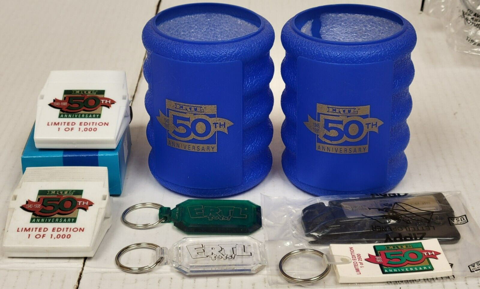ERTL 50th Anniversary 1945-1995 - Clips Keychains Can Coolers Opener (Lot of 8) ERTL 50th Anniversary 1945-1995 - Clips Keychains Can Coolers Opener (Lot of 8)