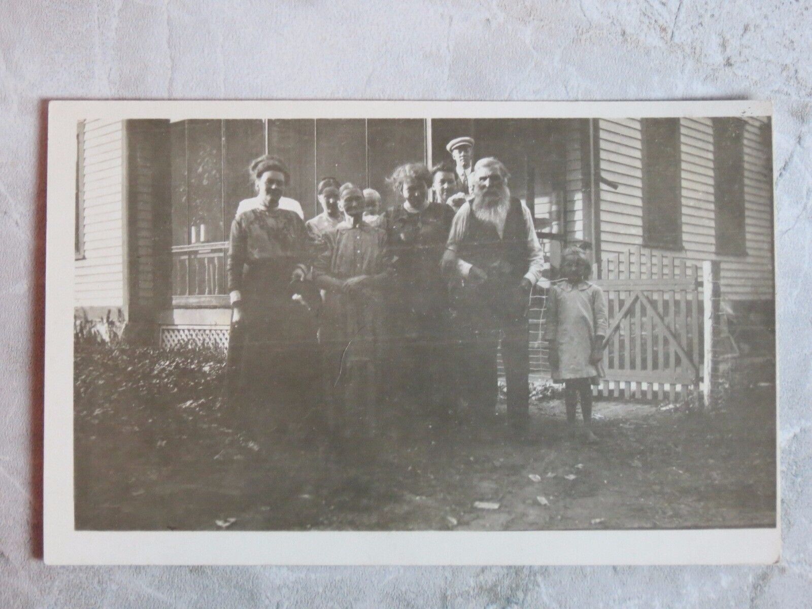 Vintage 1907-20s RPPC Postcard: Family Portrait, House, Porch in Background Vintage 1907-20s RPPC Postcard: Family Portrait, House, Porch in Background