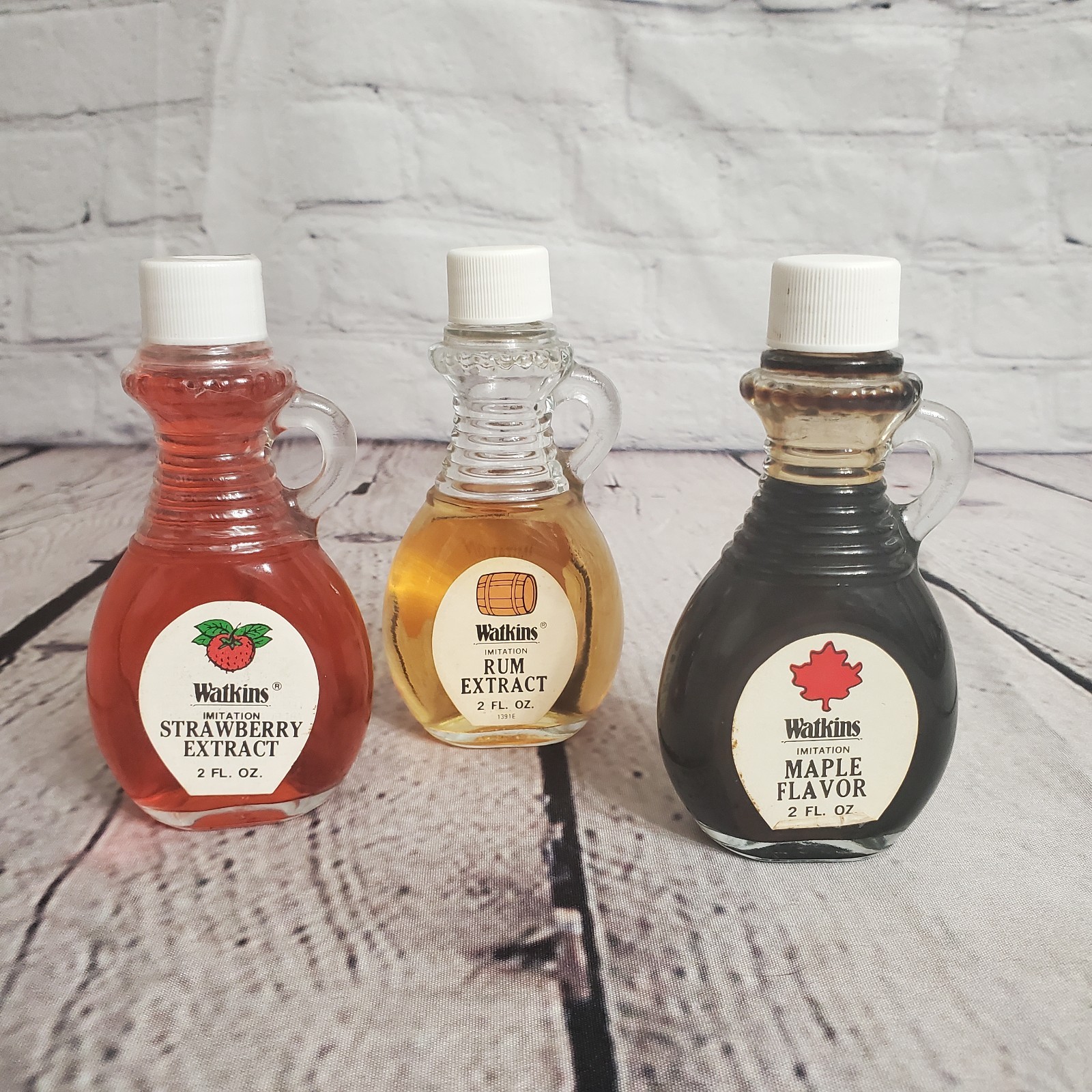 3 BOTTLES OF VINTAGE WATKINS IMITATION EXTRACTS 2oz WITH SIDE HANDLE 