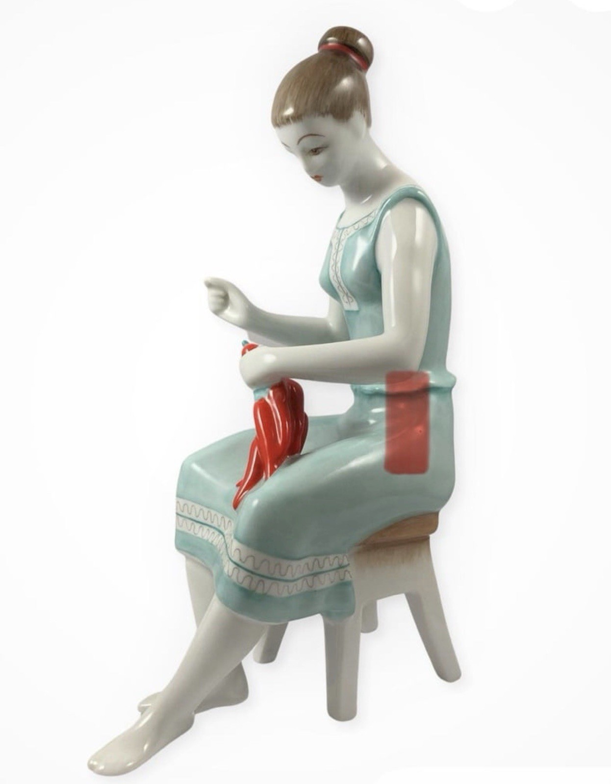 Vintage Hollohaza porcelain a woman sitting on a stool stringing paprika peppers Vintage Hollohaza porcelain a woman sitting on a stool stringing paprika peppers