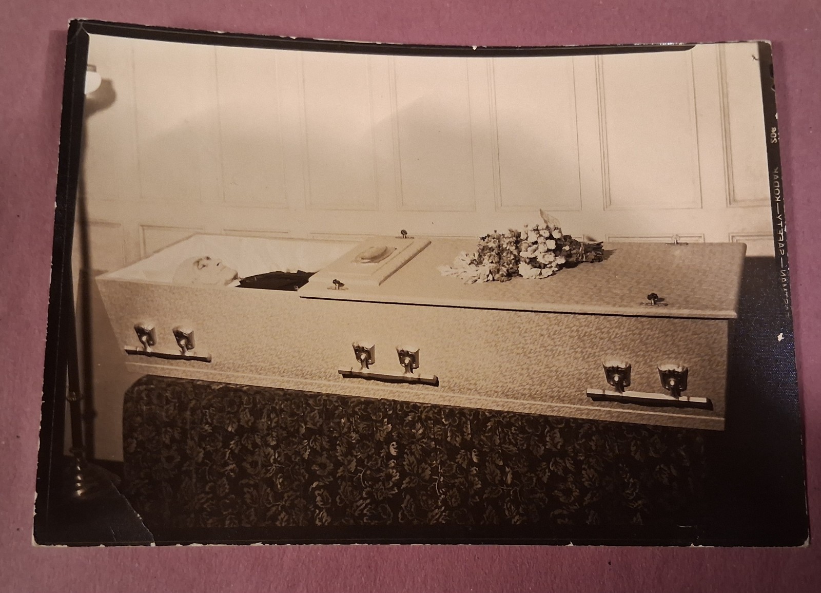 post mortem photo of old gentleman in casket in funeral home 1920s