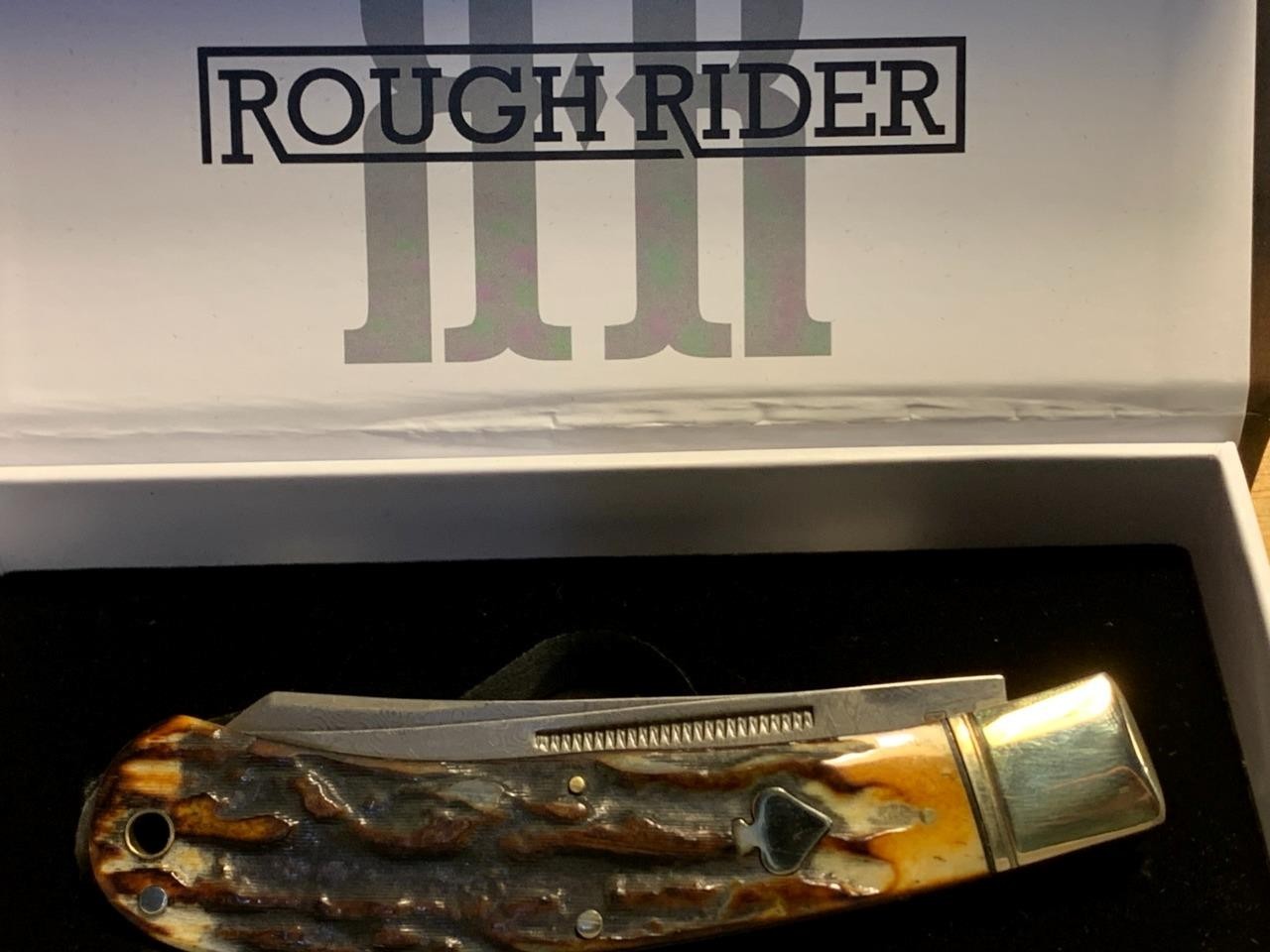 Rough Rider Cinnamon Bone Damascus Upswept Trapper 4 1/2