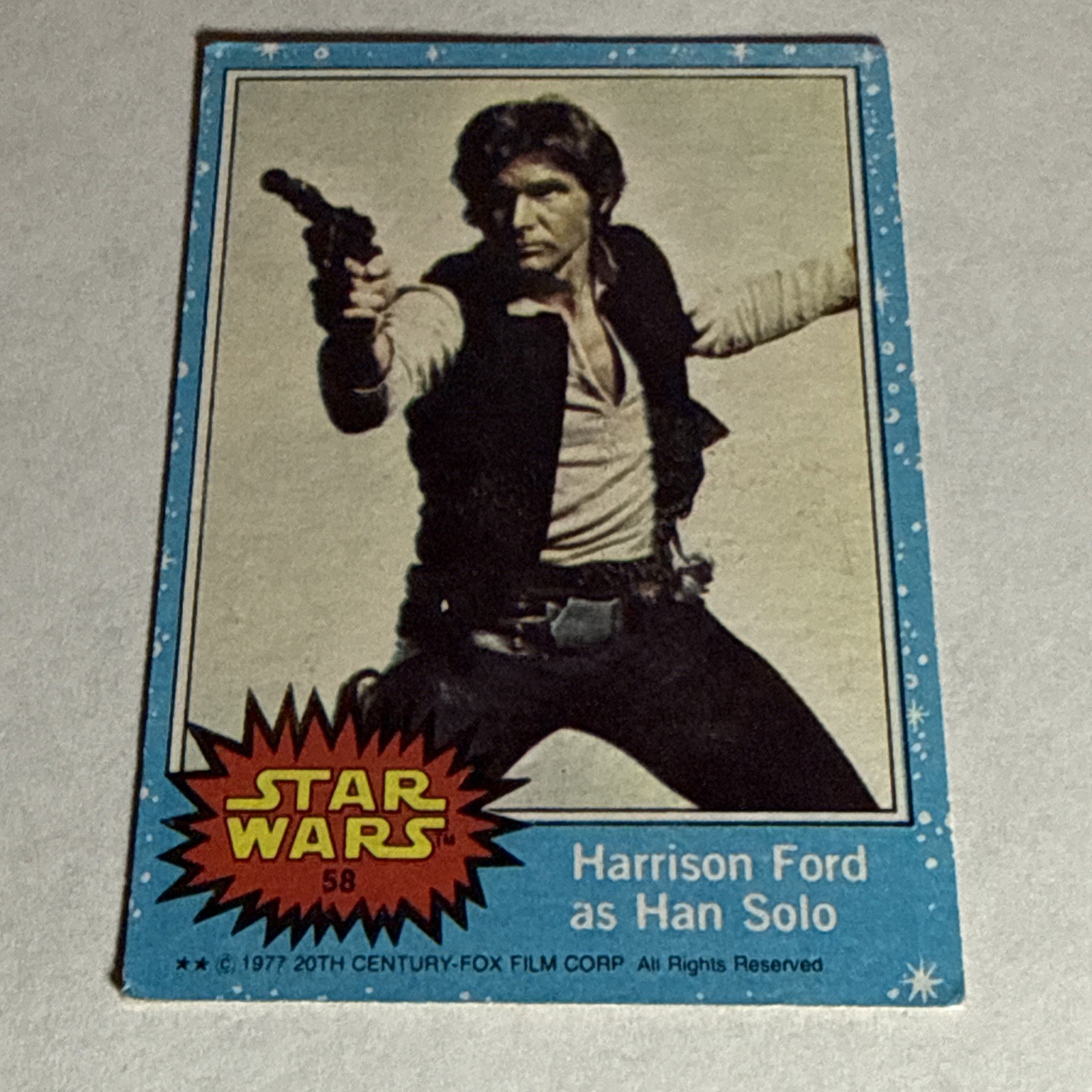 1977 Topps Star Wars #58 Harrison Ford as Han Solo Falcon 1977 Topps Star Wars #58 Harrison Ford as Han Solo Falcon