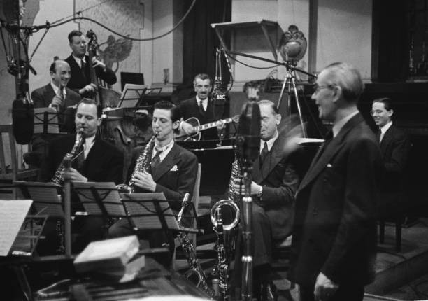 American born pianist bandleader Carroll Gibbons standing right re- Old Photo