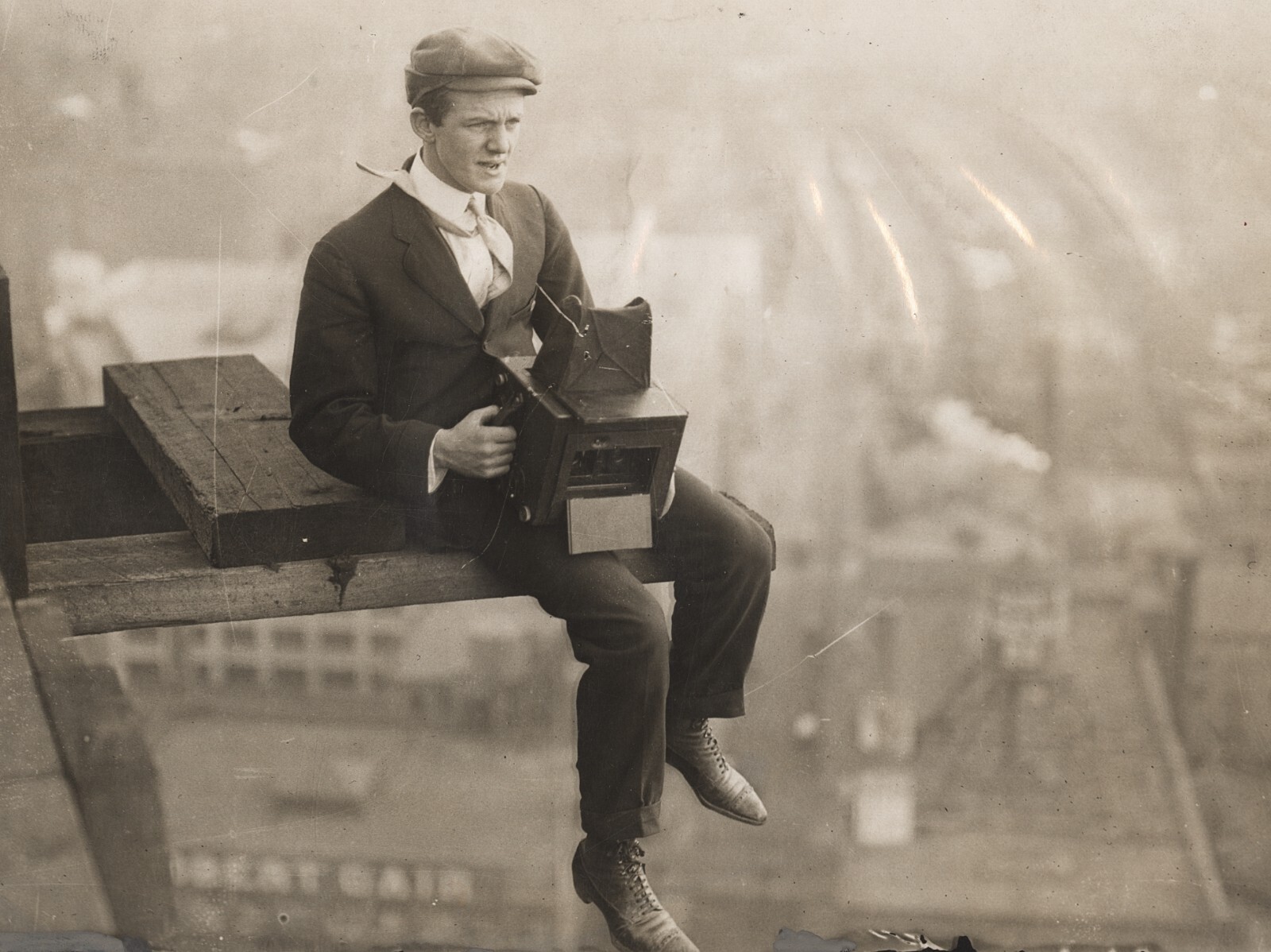 c. 1910's News Photographer Sitting on Girder of Sky Scraper Construction Photo c. 1910's News Photographer Sitting on Girder of Sky Scraper Construction Photo