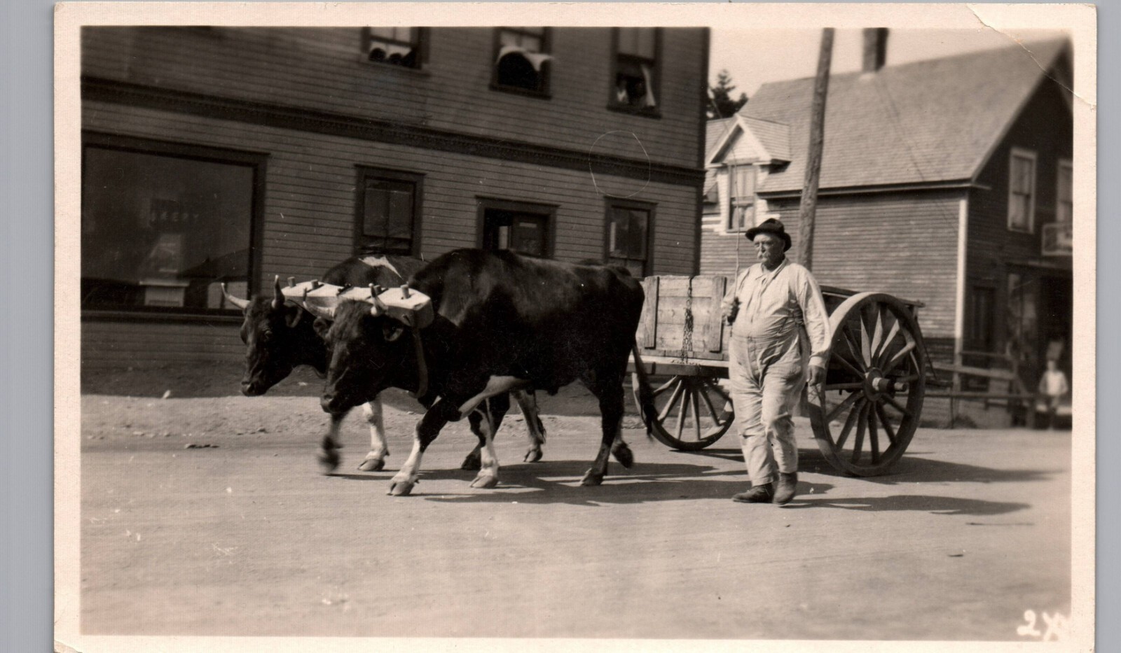OX CART & DRIVER ON STREET c1920s real photo postcard rppc ox-drawn wagon