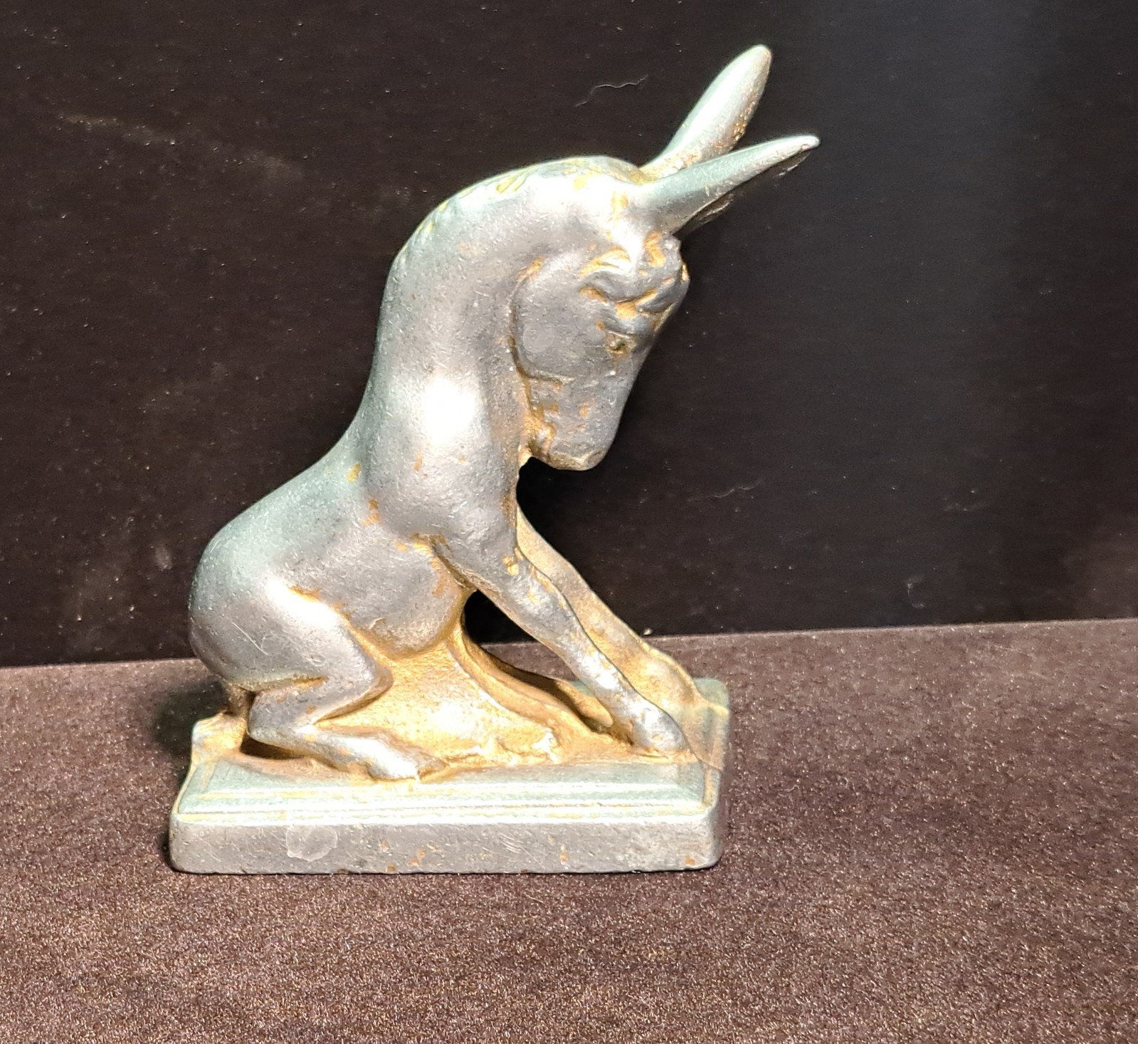 Aluminum sitting donkey on a sturdy metal base Aluminum sitting donkey on a sturdy metal base