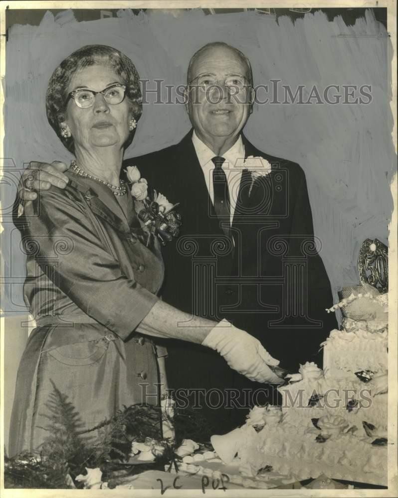 1962 Press Photo Mr. and Mrs. Charles Holmes Sr. cut their 50th wedding cake 1962 Press Photo Mr. and Mrs. Charles Holmes Sr. cut their 50th wedding cake
