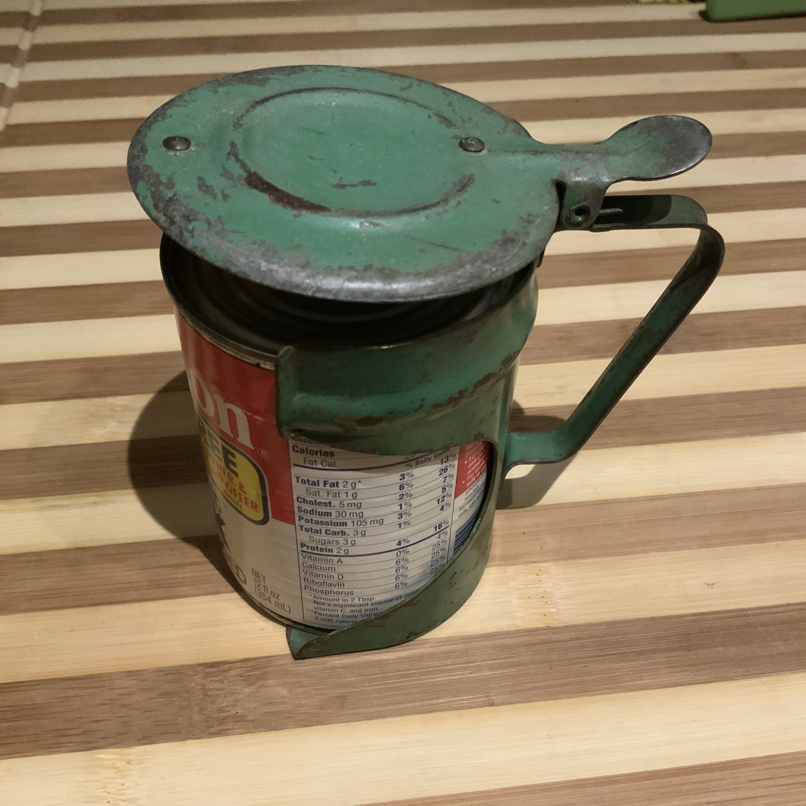 Vintage Unmarked Can Holder Piercer w/Carnation Milk Can Green