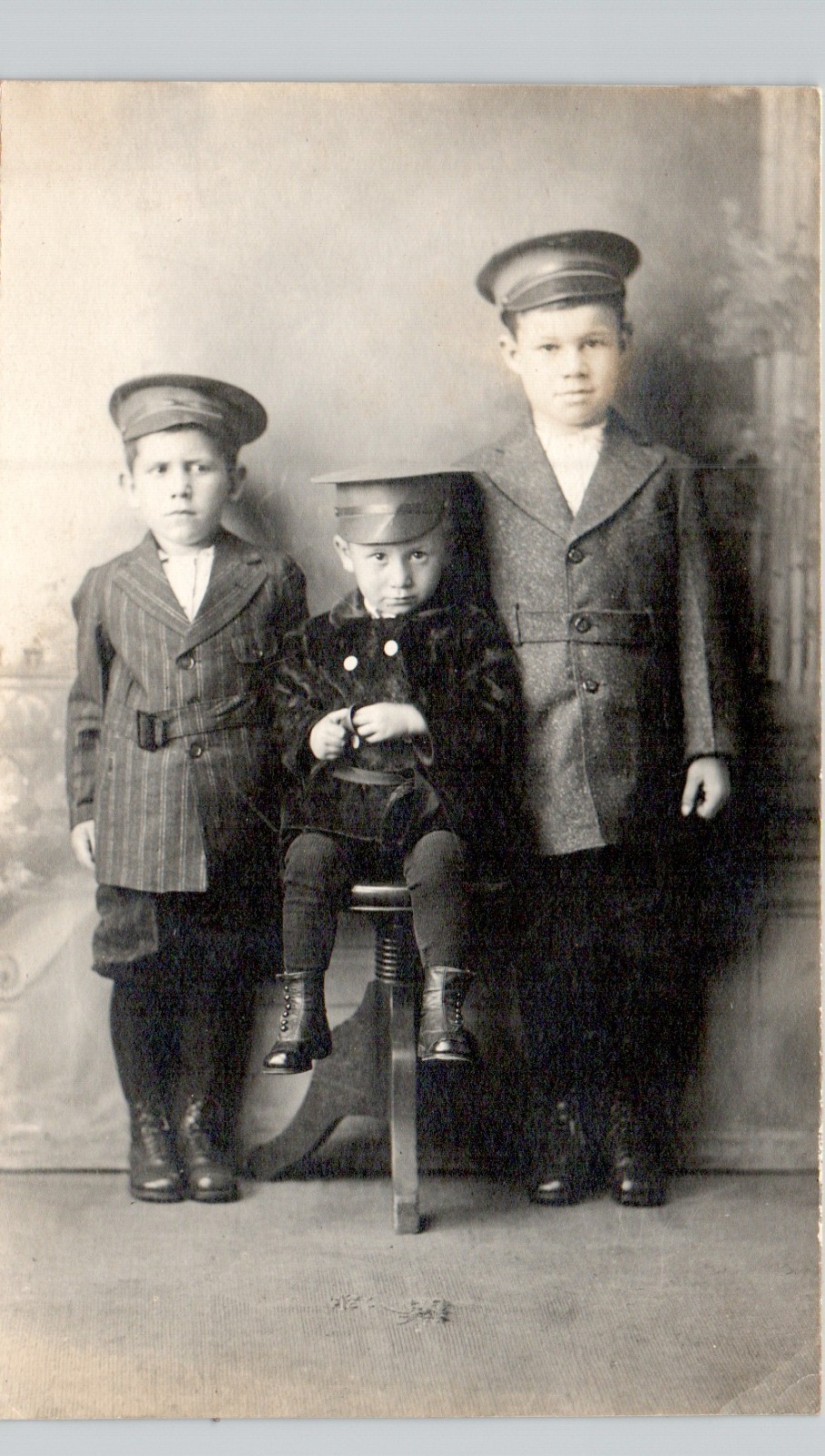 BOYS IN OFFICER HATS c1910 posstcard real photo rppc unusual portrait pose