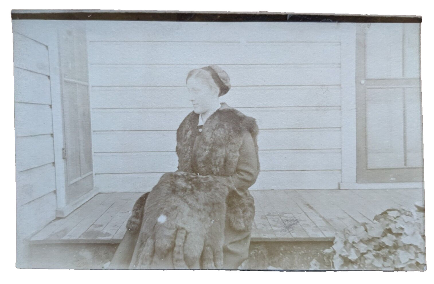 Antique RPPC Postcard Portrait of a Women On A Porch Wearing a Large Fur Stole