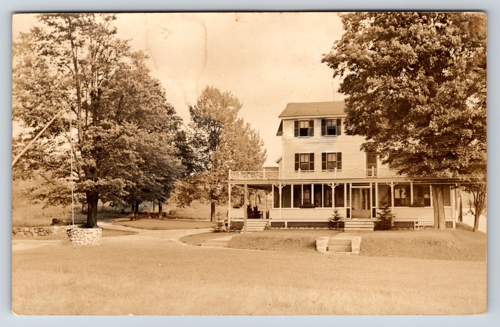 Postcard Unidentified RPPC, Possible Inn, Porch, Stone Water Well Rocking Chairs