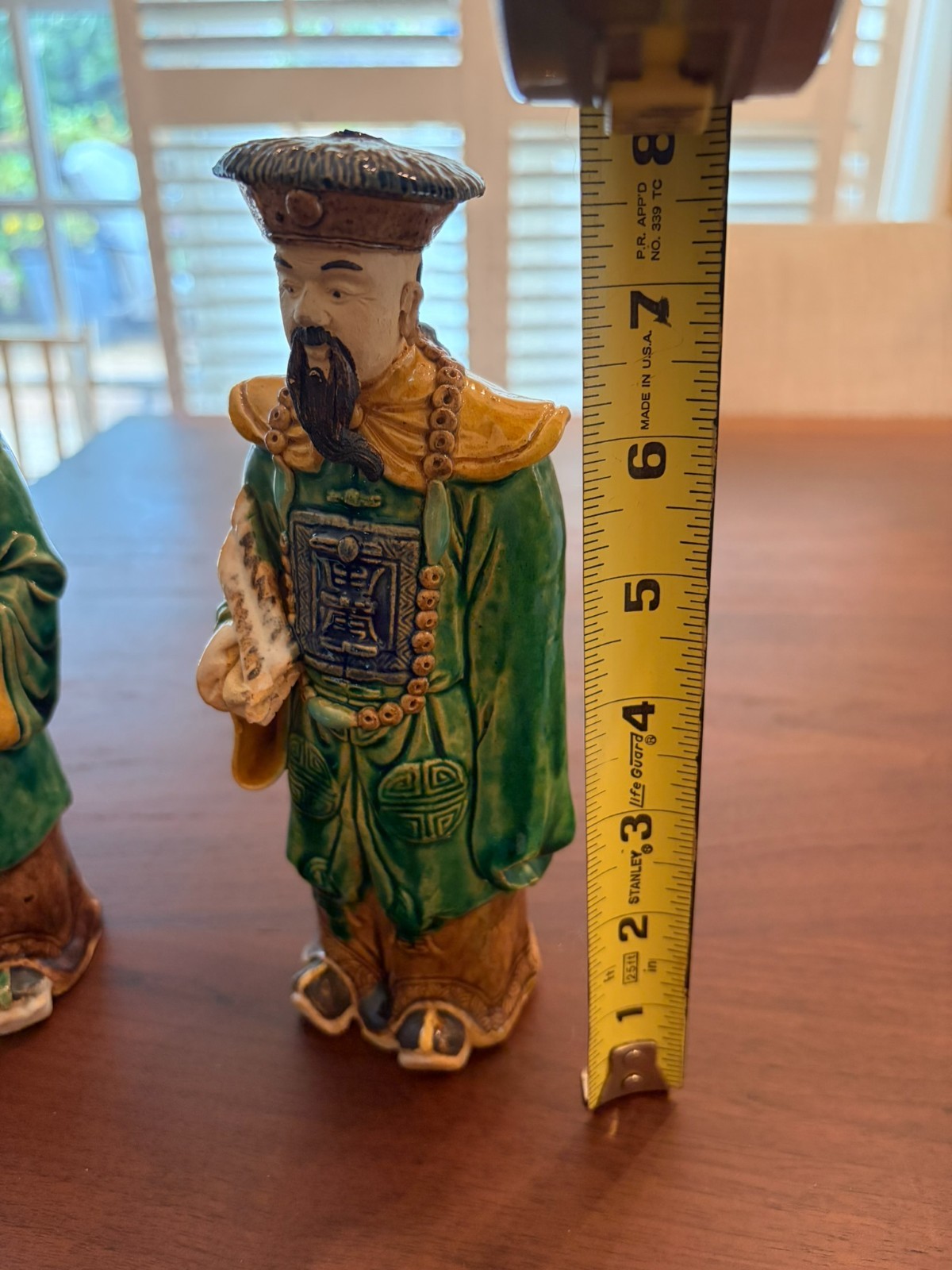 Vintage Chinese ceramic figurine of a Mandarin official. Total of two.