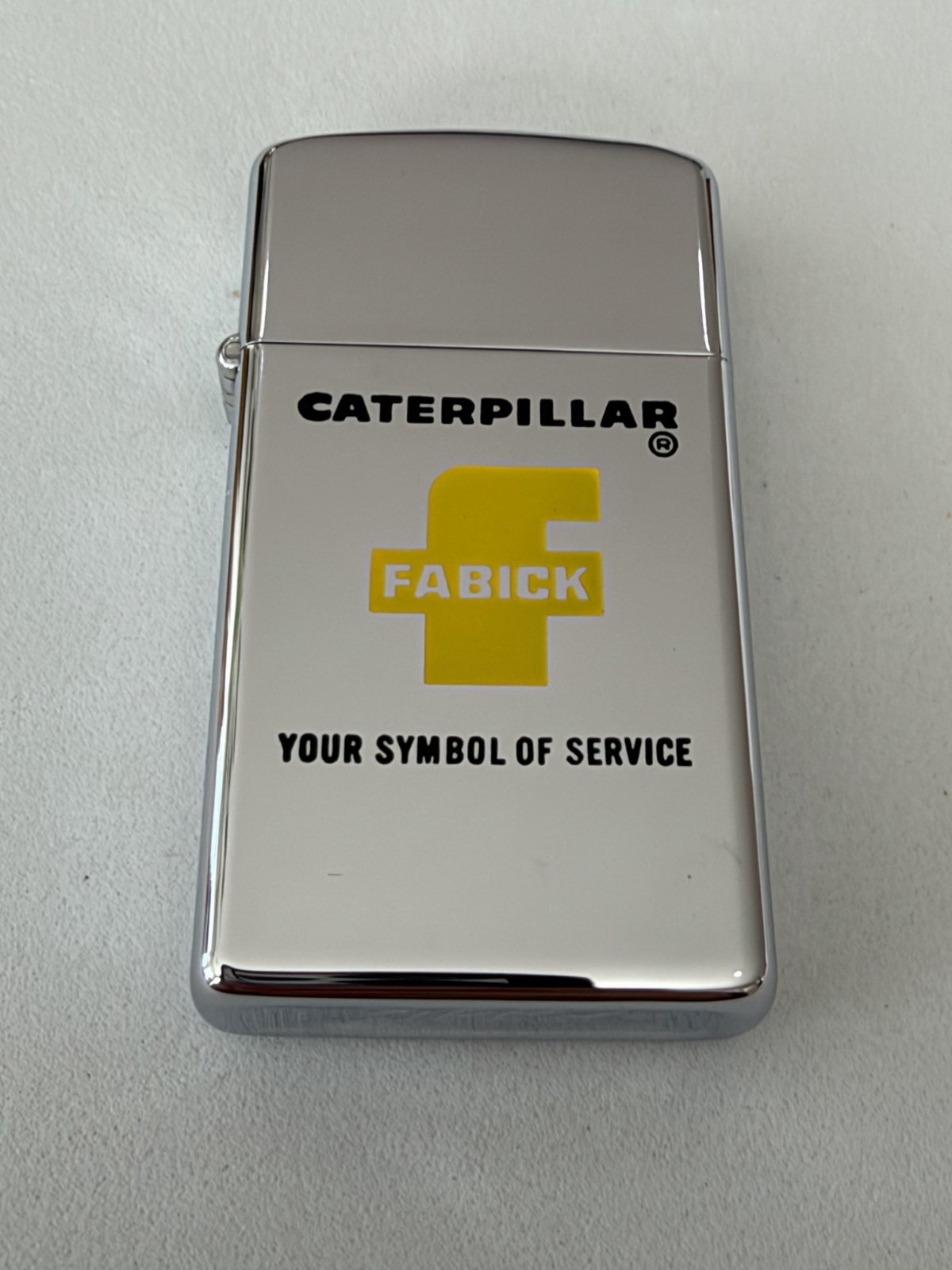 Zippo Caterpillar Fabic Advertising Chrome Slim UNSTRUCK MINT from 1968 Zippo Caterpillar Fabic Advertising Chrome Slim UNSTRUCK MINT from 1968