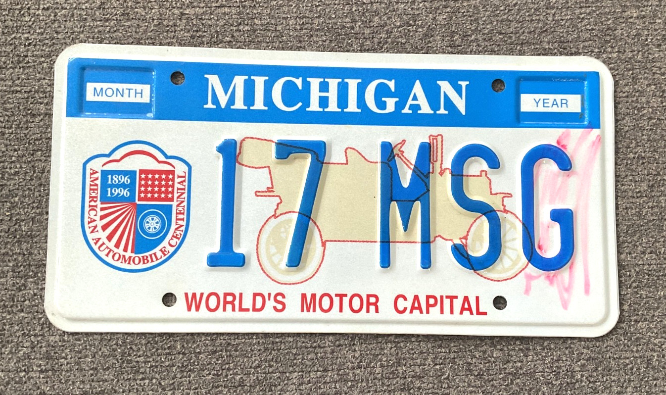 RARE 1990\'s WORLD MOTOR CAPITAL MICHIGAN GOVERNMENT MSG LICENSE PLATE RARE RARE RARE 1990\'s WORLD MOTOR CAPITAL MICHIGAN GOVERNMENT MSG LICENSE PLATE RARE RARE