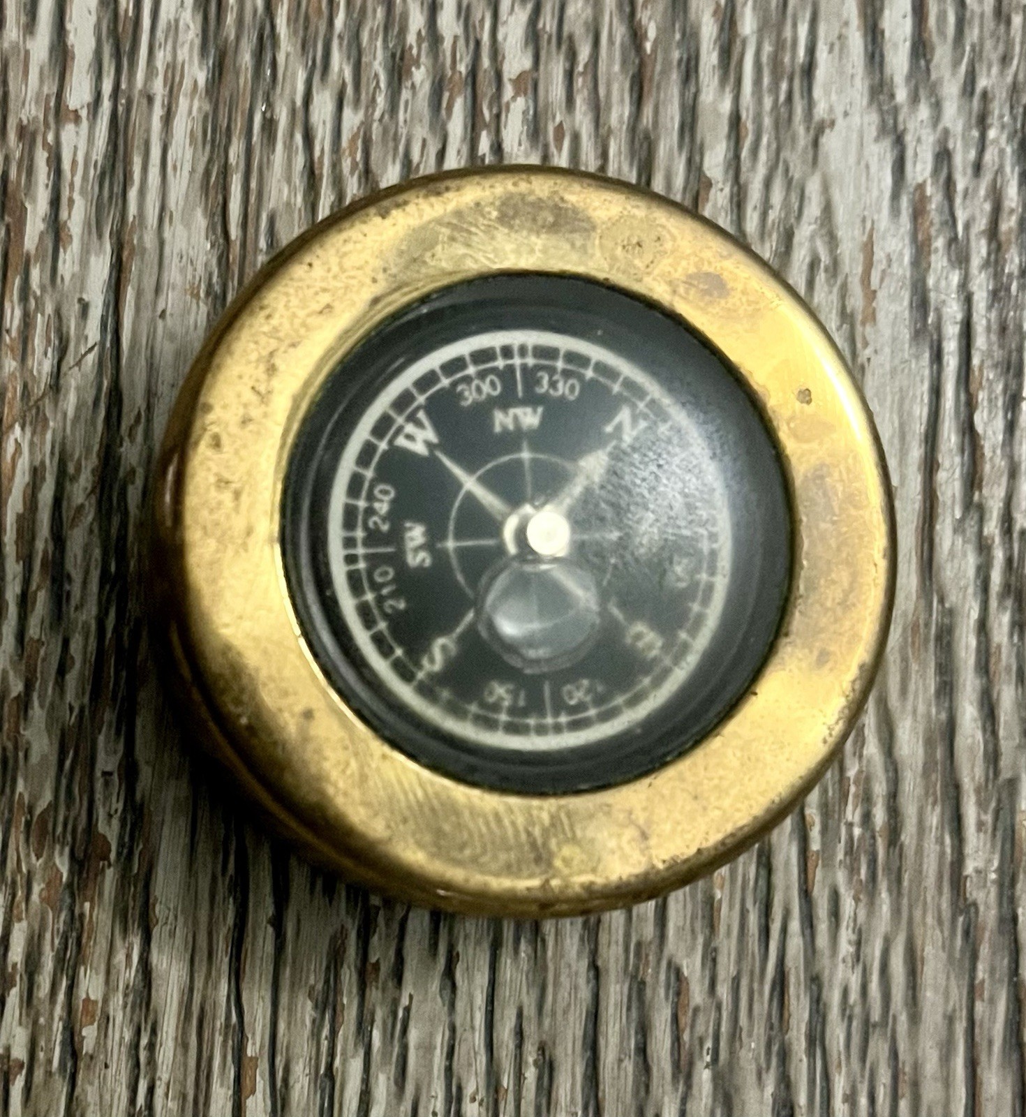 Round compass encased in brass metal cased liquid filled marked SH travel Old