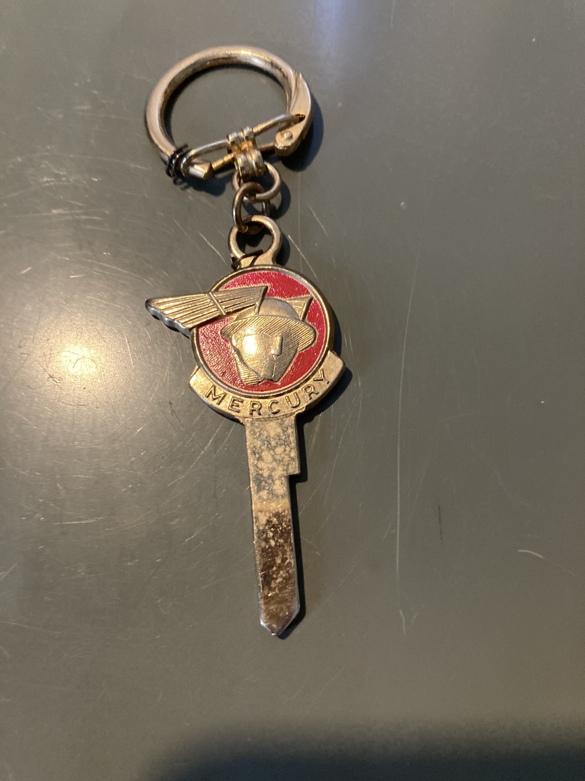 Vintage \'50s Mercury Messenger Winged Man Logo - Uncut Key Blank