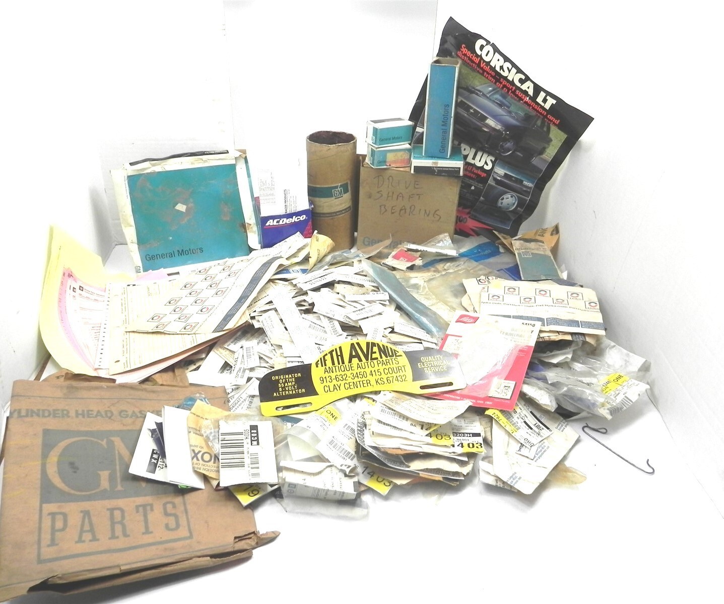 VINTAGE LOT OF 1930\'S-1990\'S GM DEALERSHIP DISPLAY LABELS BAGS TAGS AND BOXES
