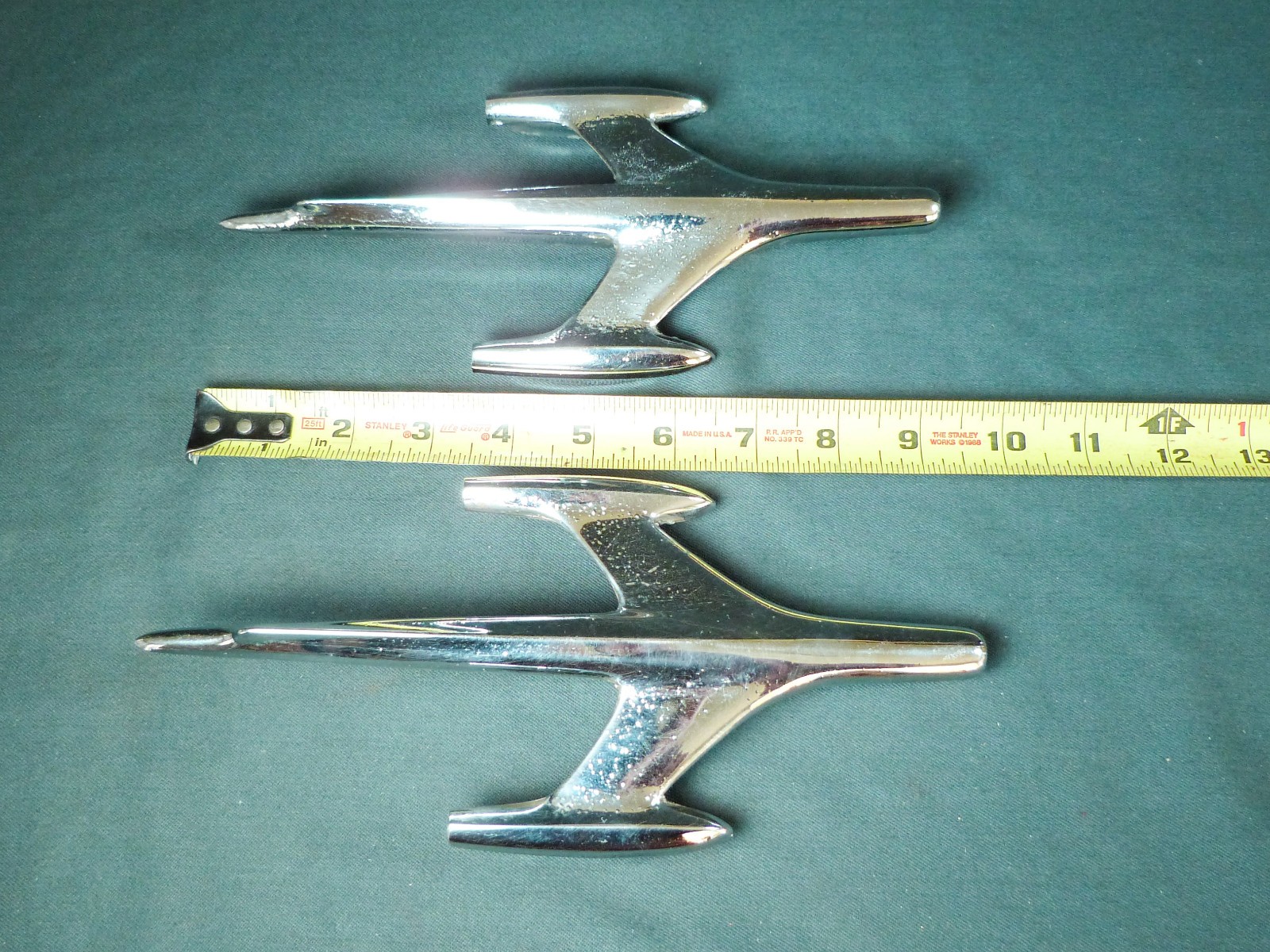 2 vintage 1957 Oldsmobile FENDER Rocket emblems / ornaments  Left and Right