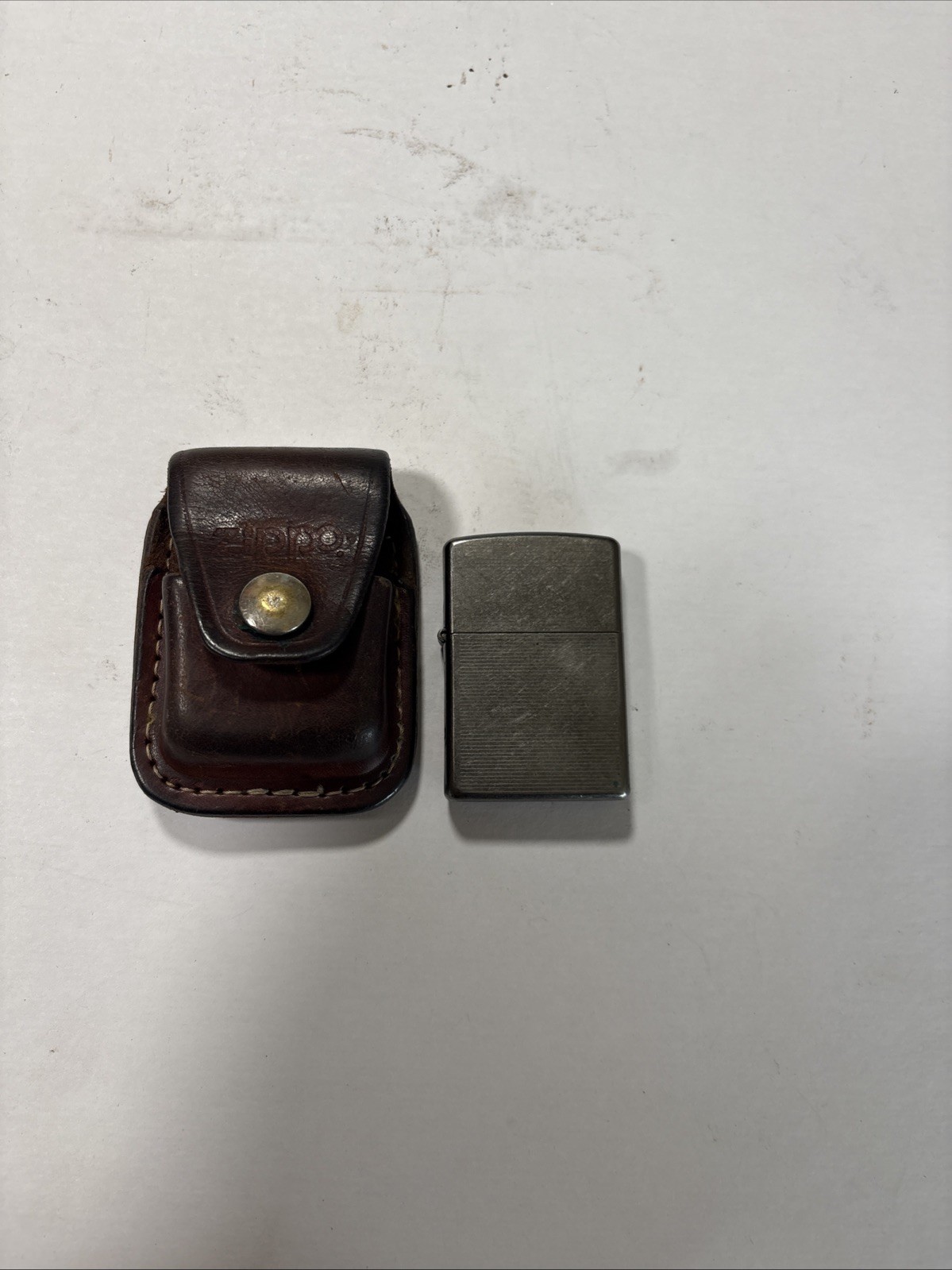 Zippo Lighter April 2006 Has Seal with Leather Pouch Holder Case Belt Loop Zippo Lighter April 2006 Has Seal with Leather Pouch Holder Case Belt Loop