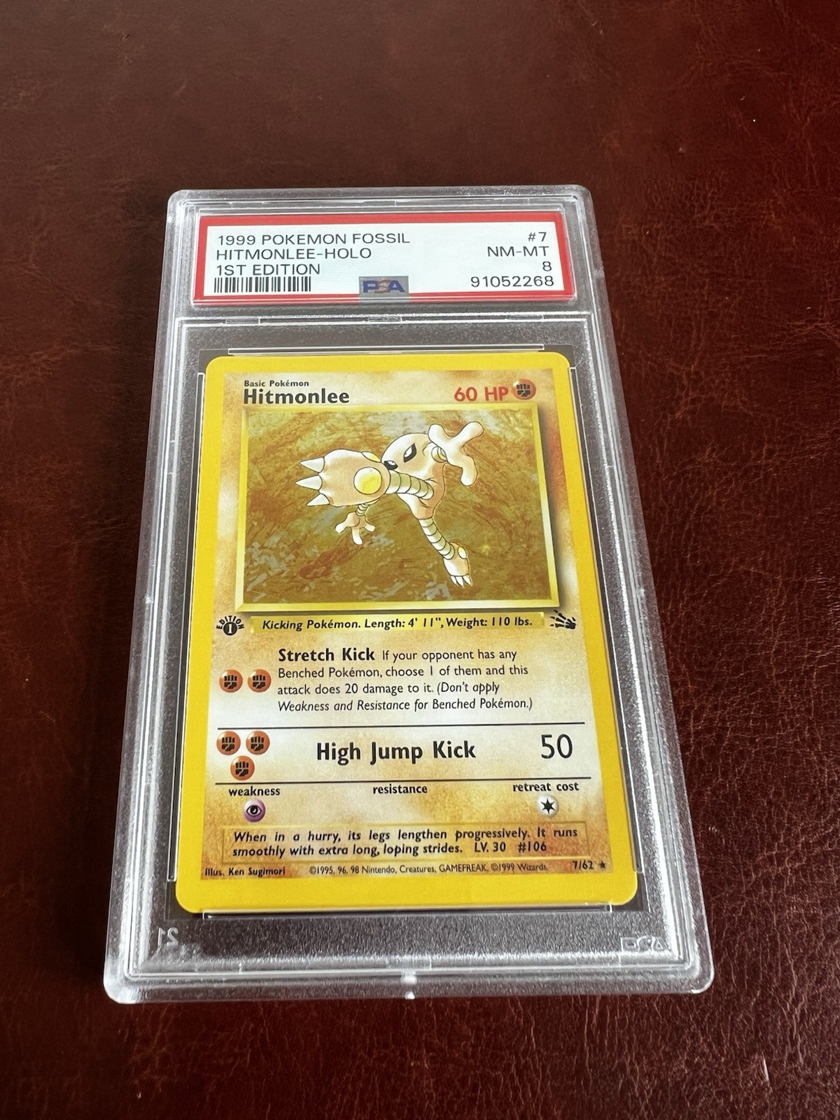 Hitmonlee 7/62 (PSA 8) - 1st Edition Fossil First - 1999 Pokemon Holo NM-MINT