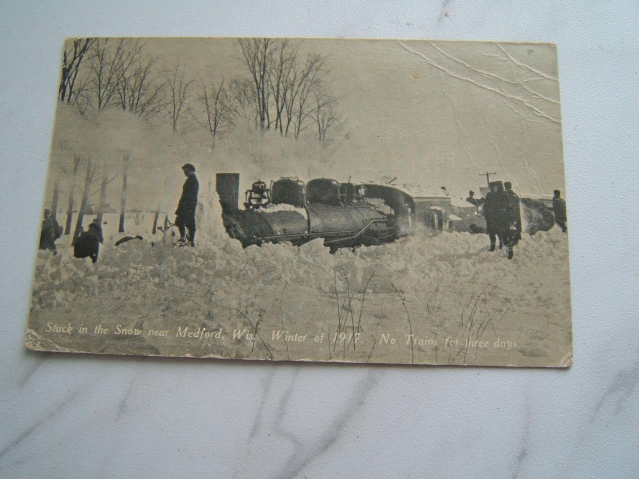 VINTAGE 1917 MEDFORD, WIS. TRAIN STUCK IN THE SNOW FOR 3 DAYS POSTCARD