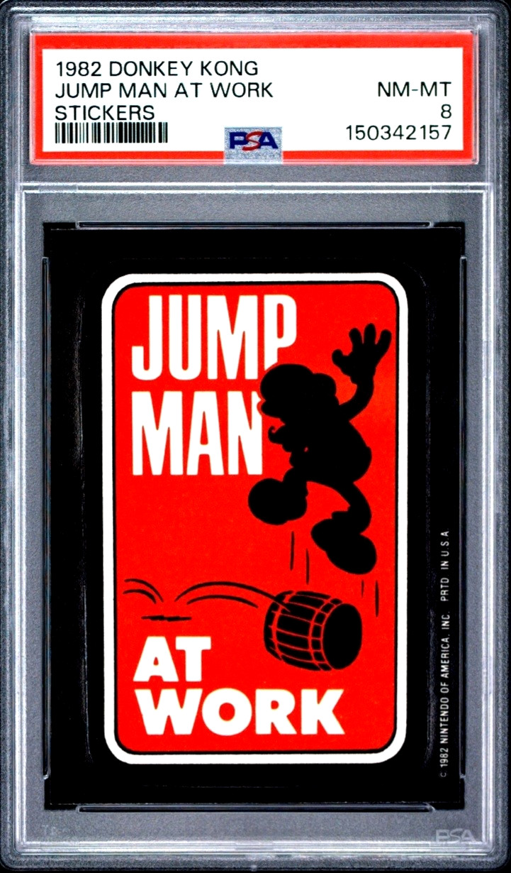 1982 Donkey Kong Sticker Jump Man at Work -Super Mario Silhoutte Rookie PSA 8 1982 Donkey Kong Sticker Jump Man at Work -Super Mario Silhoutte Rookie PSA 8