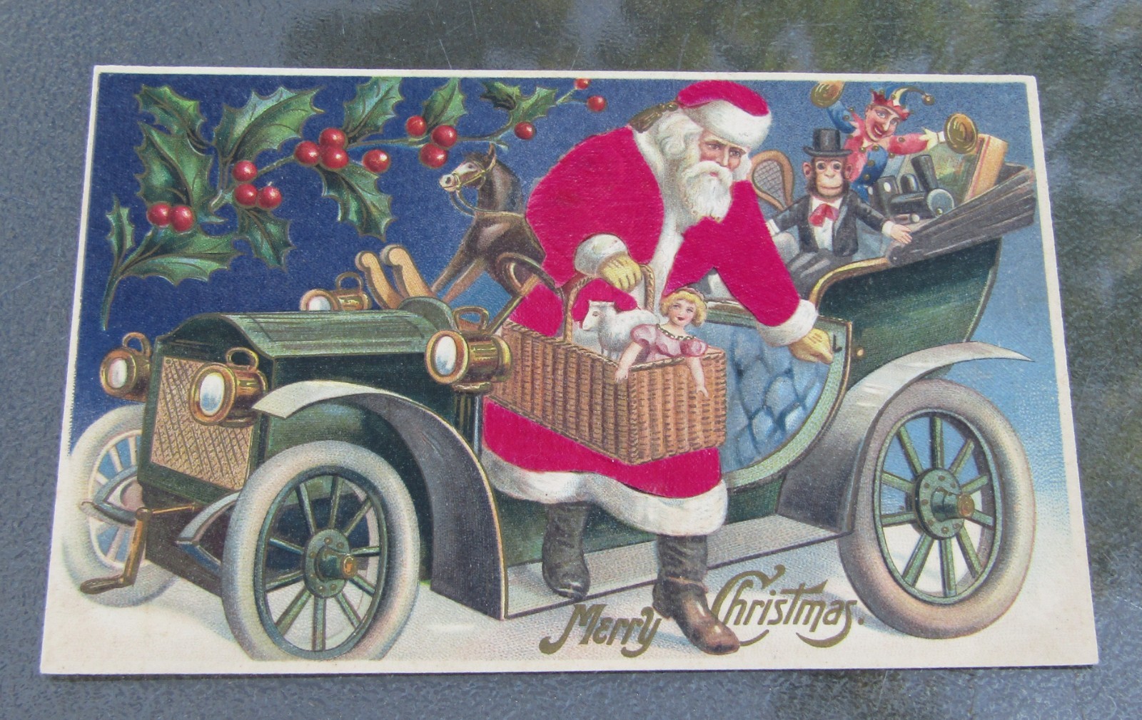 1900s Made In Germany Embossed MERRY CHRISTMAS Postcard Santa Brass Era Car Toys