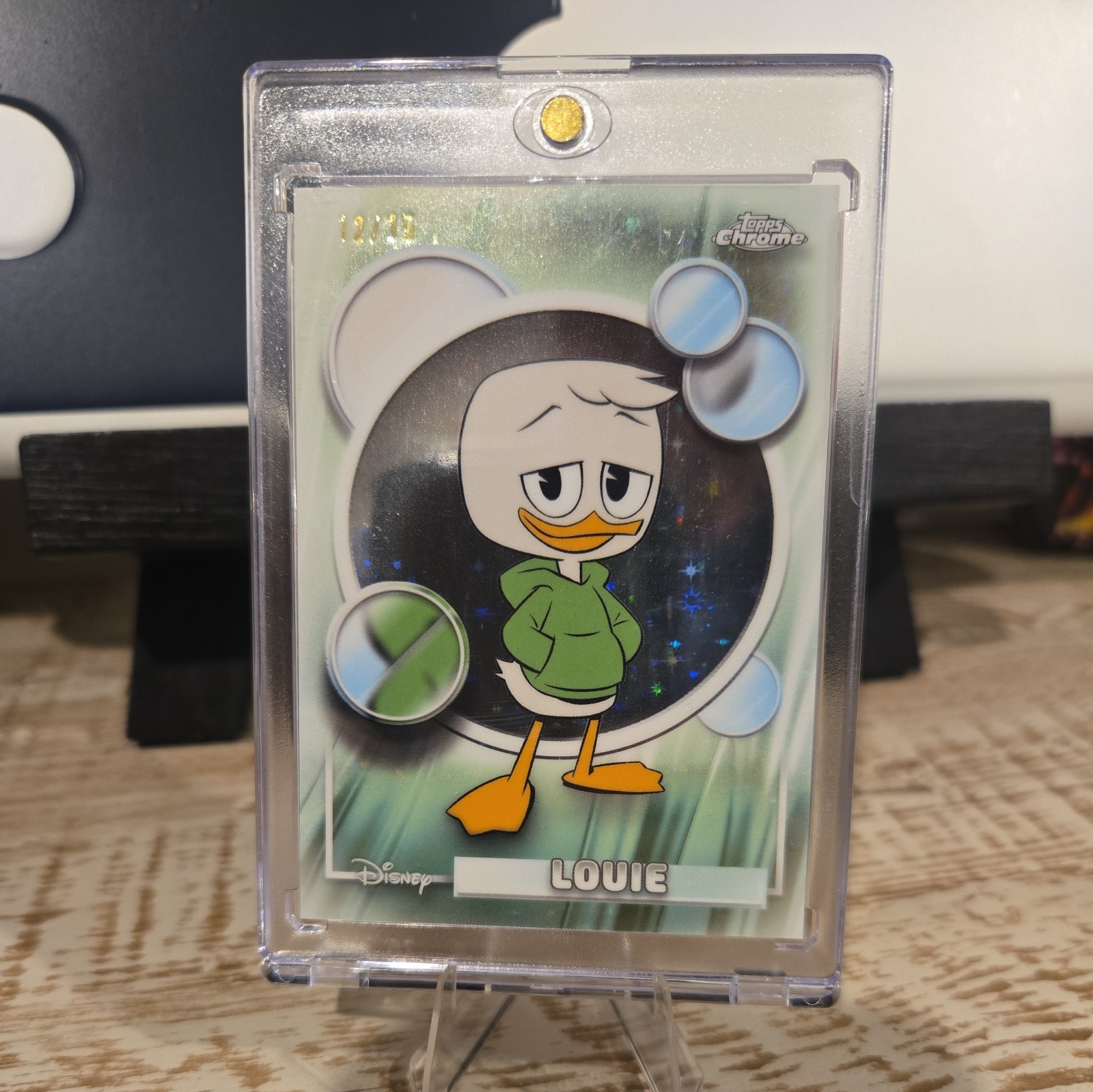 2026 Topps Chrome Disney LOUIE STARS IN THE NIGHT Refractor 03/15 #121